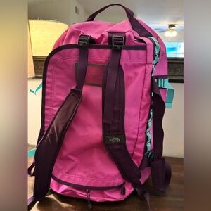 The North Face Pink and Purple Backpack with Sturdy Design
